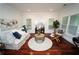 Cozy living room with hardwood floors, comfortable seating, and ample natural light at 550 Quillian Ave, Decatur, GA 30032