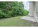 Lush backyard with green lawn and trees creating a serene outdoor space for the home at 5937 Yellowood Ct, Atlanta, GA 30349