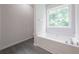 Bright bathroom features soaking tub and window view at 5937 Yellowood Ct, Atlanta, GA 30349