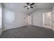 Spacious bedroom with plush carpeting and two windows at 5937 Yellowood Ct, Atlanta, GA 30349