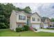 Inviting two-story home with green lawn, brick accents, and a two-car garage at 5937 Yellowood Ct, Atlanta, GA 30349