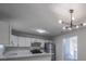 Bright kitchen features white cabinets, granite countertops, and stainless steel appliances at 5937 Yellowood Ct, Atlanta, GA 30349