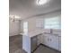 Bright kitchen features white cabinets, stainless steel dishwasher, and granite countertops at 5937 Yellowood Ct, Atlanta, GA 30349