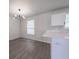 Bright kitchen features white cabinets and eat-in dining area at 5937 Yellowood Ct, Atlanta, GA 30349
