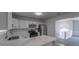 Kitchen features white cabinets, granite countertops, and stainless steel appliances at 5937 Yellowood Ct, Atlanta, GA 30349