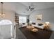Cozy living room with lots of natural light, ceiling fan, neutral paint, and stylish decor at 5937 Yellowood Ct, Atlanta, GA 30349