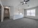 Open-concept living room with modern grey carpet and bright neutral paint at 5937 Yellowood Ct, Atlanta, GA 30349