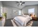 Serene main bedroom with neutral walls, ceiling fan, and bright natural light at 5937 Yellowood Ct, Atlanta, GA 30349