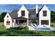 This is an exterior rendering of a modern home with white brick, a covered patio, and an in-ground pool at 7160 Shady Grove Rd, Cumming, GA 30041