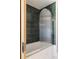 Stylish bathroom with a sleek, modern glass-enclosed shower and dark tile, offering a luxurious and contemporary bathing experience at 1130 Mclinden Se Ave, Smyrna, GA 30080