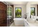 Modern bathroom with soaking tub, glass shower, and contemporary vanity at 1130 Mclinden Se Ave, Smyrna, GA 30080