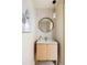 Chic bathroom featuring a modern vanity, round mirror, and stylish lighting fixture, creating a sophisticated and inviting space at 1130 Mclinden Se Ave, Smyrna, GA 30080