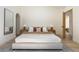 Well-lit bedroom with neutral tones, hardwood floors, and an arched doorway at 1130 Mclinden Se Ave, Smyrna, GA 30080