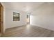 Bright, minimalist bedroom with wood floors and large windows, offering ample natural light and a spacious feel at 1130 Mclinden Se Ave, Smyrna, GA 30080