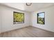 Inviting bedroom with natural light streaming through large windows, highlighting the light wood floors and spacious layout at 1130 Mclinden Se Ave, Smyrna, GA 30080