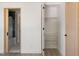 Well-organized closet featuring adjustable shelves, alongside a glimpse into a modern bathroom, maximizing storage and style at 1130 Mclinden Se Ave, Smyrna, GA 30080