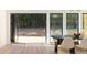 Bright dining room with folding glass doors that open to a wooded backyard at 1130 Mclinden Se Ave, Smyrna, GA 30080