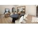 Spacious dining room with a modern table, stylish chairs, and hardwood floors at 1130 Mclinden Se Ave, Smyrna, GA 30080