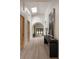 Bright hallway featuring high ceilings, skylight, light hardwood floors and an archway leading to living spaces at 1130 Mclinden Se Ave, Smyrna, GA 30080