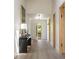 Hallway with hardwood floors, console table, and an open door to the outside at 1130 Mclinden Se Ave, Smyrna, GA 30080