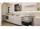 Contemporary kitchen features stainless steel appliances, sleek white countertops and ample cabinet space at 1130 Mclinden Se Ave, Smyrna, GA 30080