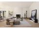 Bright and airy living room with fireplace, wall art, and comfortable tan sectional sofa at 1130 Mclinden Se Ave, Smyrna, GA 30080