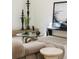 Modern living room with a tan sectional sofa, glass table, and striking art pieces at 1130 Mclinden Se Ave, Smyrna, GA 30080