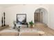 Bright open living room featuring modern art, archway entry, and sleek modern furnishings at 1130 Mclinden Se Ave, Smyrna, GA 30080