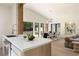 Modern living room area boasts open floorplan with kitchen access and a view of the backyard at 1130 Mclinden Se Ave, Smyrna, GA 30080