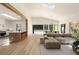 Open concept living space with modern decor, skylights, and folding glass doors at 1130 Mclinden Se Ave, Smyrna, GA 30080