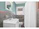 This bathroom features colorful vintage tile, large mirror, and a shower-tub combination at 1425 Dalewood Ne Dr, Atlanta, GA 30329
