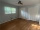 Bright bedroom with hardwood floors, ceiling fan, and ample closet space at 1425 Dalewood Ne Dr, Atlanta, GA 30329