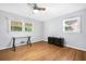 A simple bedroom features wood floors, neutral walls and two windows for great natural lighting at 1425 Dalewood Ne Dr, Atlanta, GA 30329