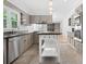 Bright kitchen featuring stainless appliances, ample cabinet space, and stone floors at 1425 Dalewood Ne Dr, Atlanta, GA 30329