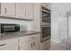 Neutral kitchen featuring stainless oven and a view of the hallway at 1425 Dalewood Ne Dr, Atlanta, GA 30329