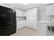 Practical laundry area featuring a refrigerator, washer, sink, and ample storage at 1425 Dalewood Ne Dr, Atlanta, GA 30329