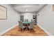 Basement game room featuring round table and seating on wood-look flooring at 2230 Ewing Chapel Rd, Dacula, GA 30019