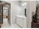 Bathroom featuring tile floors, single vanity, mirror, recessed lighting and access to the bedroom at 2230 Ewing Chapel Rd, Dacula, GA 30019