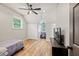 Upstairs bedroom includes wood floors, recessed lighting, windows and closet space for storage at 2230 Ewing Chapel Rd, Dacula, GA 30019