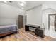 Spacious bedroom with wood floors, recessed lighting, desk, closet and access to a full bathroom at 2230 Ewing Chapel Rd, Dacula, GA 30019