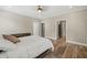 A neutral bedroom with dark wood floors and a ceiling fan at 2230 Ewing Chapel Rd, Dacula, GA 30019