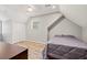 Bedroom with wood floors, closet, recessed lighting, window and a bed with gray bedding at 2230 Ewing Chapel Rd, Dacula, GA 30019