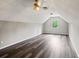 This is an open bonus room featuring vinyl plank flooring, recessed lighting, and natural light from a single window at 2230 Ewing Chapel Rd, Dacula, GA 30019