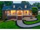 Beautiful two-story home featuring a manicured front yard, and a welcoming front porch with lighting at 2230 Ewing Chapel Rd, Dacula, GA 30019