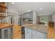 Open kitchen with granite countertops, gray cabinetry, stainless steel appliances, and hardwood floors at 2230 Ewing Chapel Rd, Dacula, GA 30019