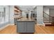 Modern kitchen with granite countertops, gray cabinets, stainless steel appliances, and hardwood floors at 2230 Ewing Chapel Rd, Dacula, GA 30019