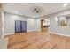 Open living room featuring wood-look flooring, recessed lights and access to a bar area at 2230 Ewing Chapel Rd, Dacula, GA 30019