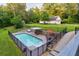 Aerial view of backyard pool featuring iron fence surround, in-ground spa, and lounge seating at 2230 Ewing Chapel Rd, Dacula, GA 30019