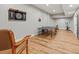 This recreation room features wood floors, recessed lighting, a ping pong table, dart board, and exercise equipment at 2230 Ewing Chapel Rd, Dacula, GA 30019