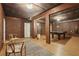 Finished basement featuring brick walls, a wooden floor, and a ping pong table for entertainment at 315 Glengarry Chase, Covington, GA 30014